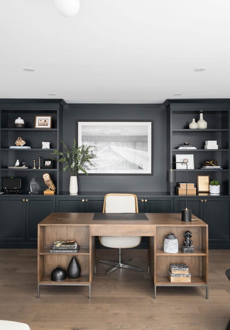 Modern office interior with painted grey wall and wood desk